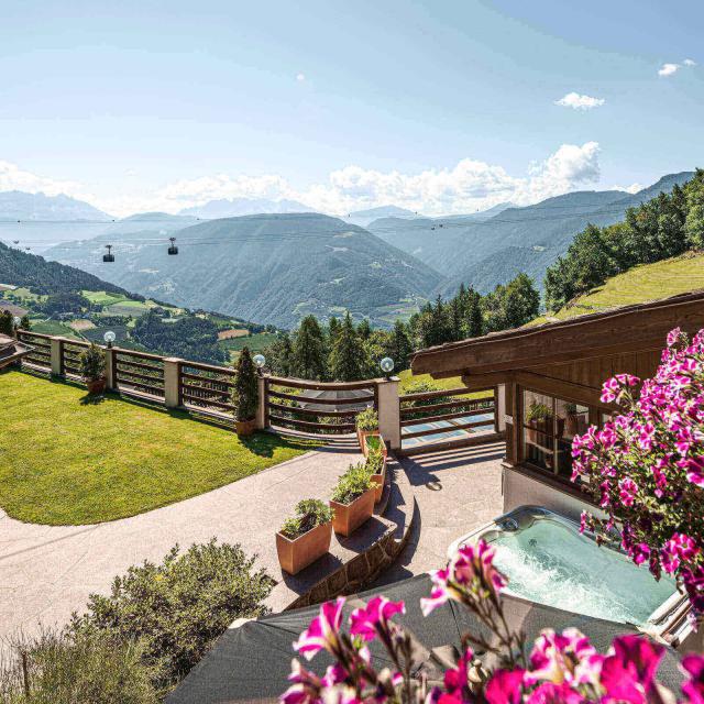 View from Dolomites Suite to the Dolomites and below Superior Suites's terrace with private whirlpool